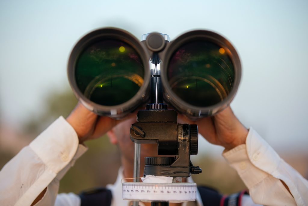 man with binoculars