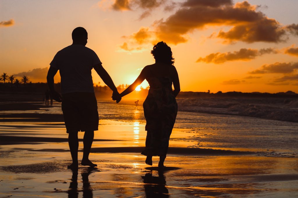 older couple holding hands