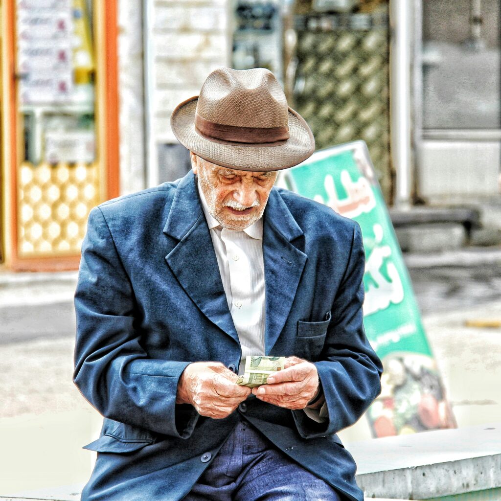 Old man counting his money